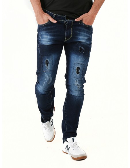 Orbe jeans azul oscuro con rotos.Modelo skinny estrecho de cinco bolsillos con cremallera y boton metalico.