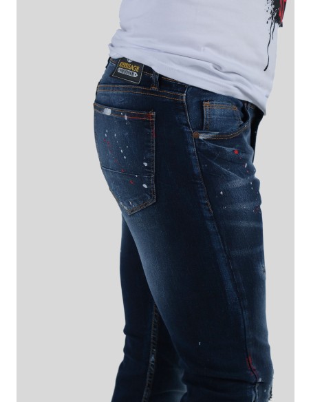  lavado oscuro con rotos y pintura. Cierre cremallera.